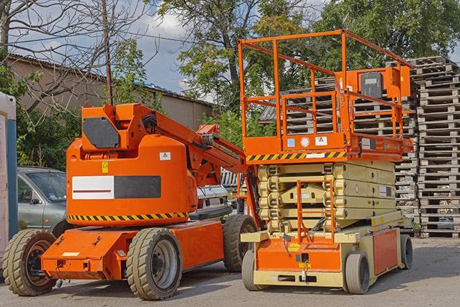 forklift maneuvering between aisles in a crowded warehouse in Albert Lea